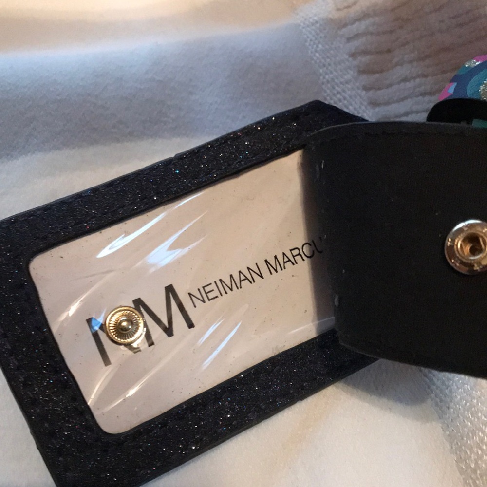 Norman Marcus luggage tag